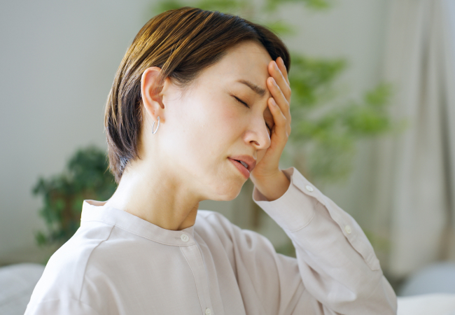 体調不良の女性